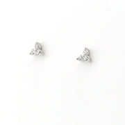Pair of silver stud earrings on a white background