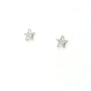 Star-shaped silver earrings on a white background