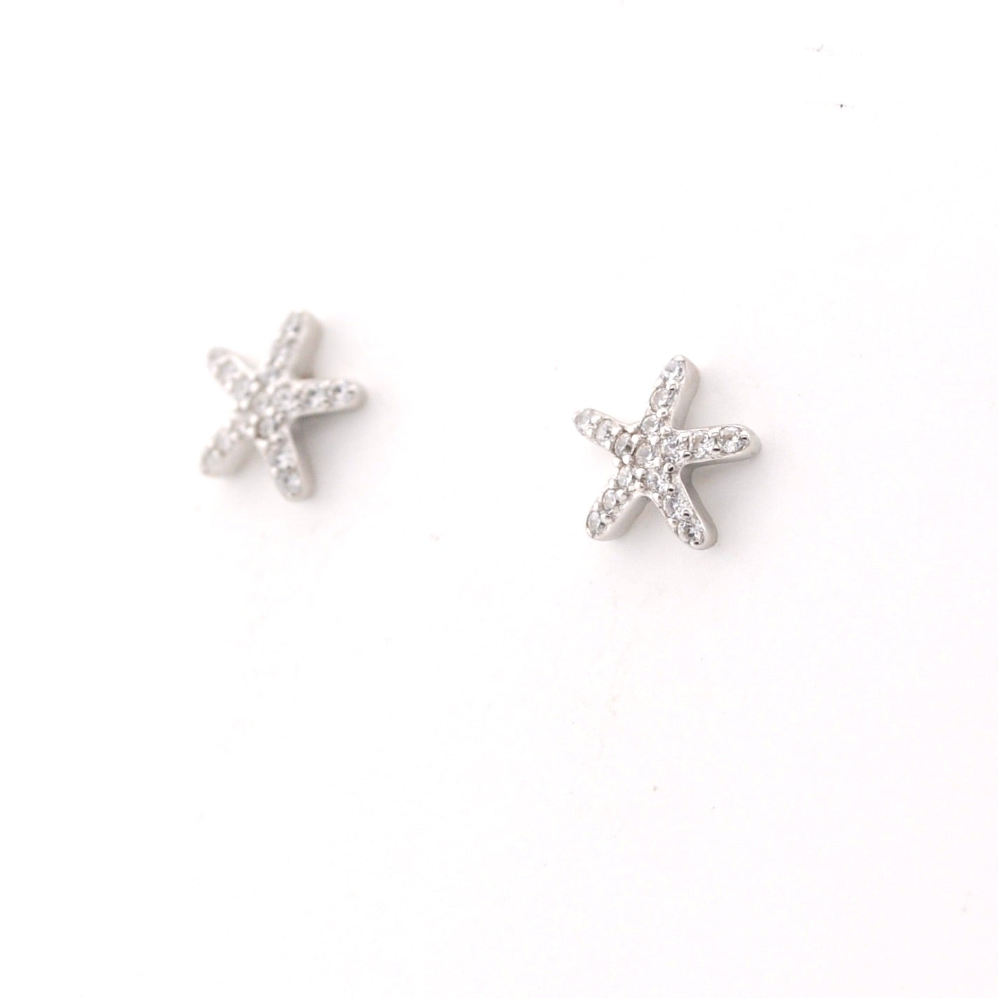 Starfish silver earrings on a white background