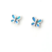 Butterfly-shaped earrings with blue opal inlay on a white background