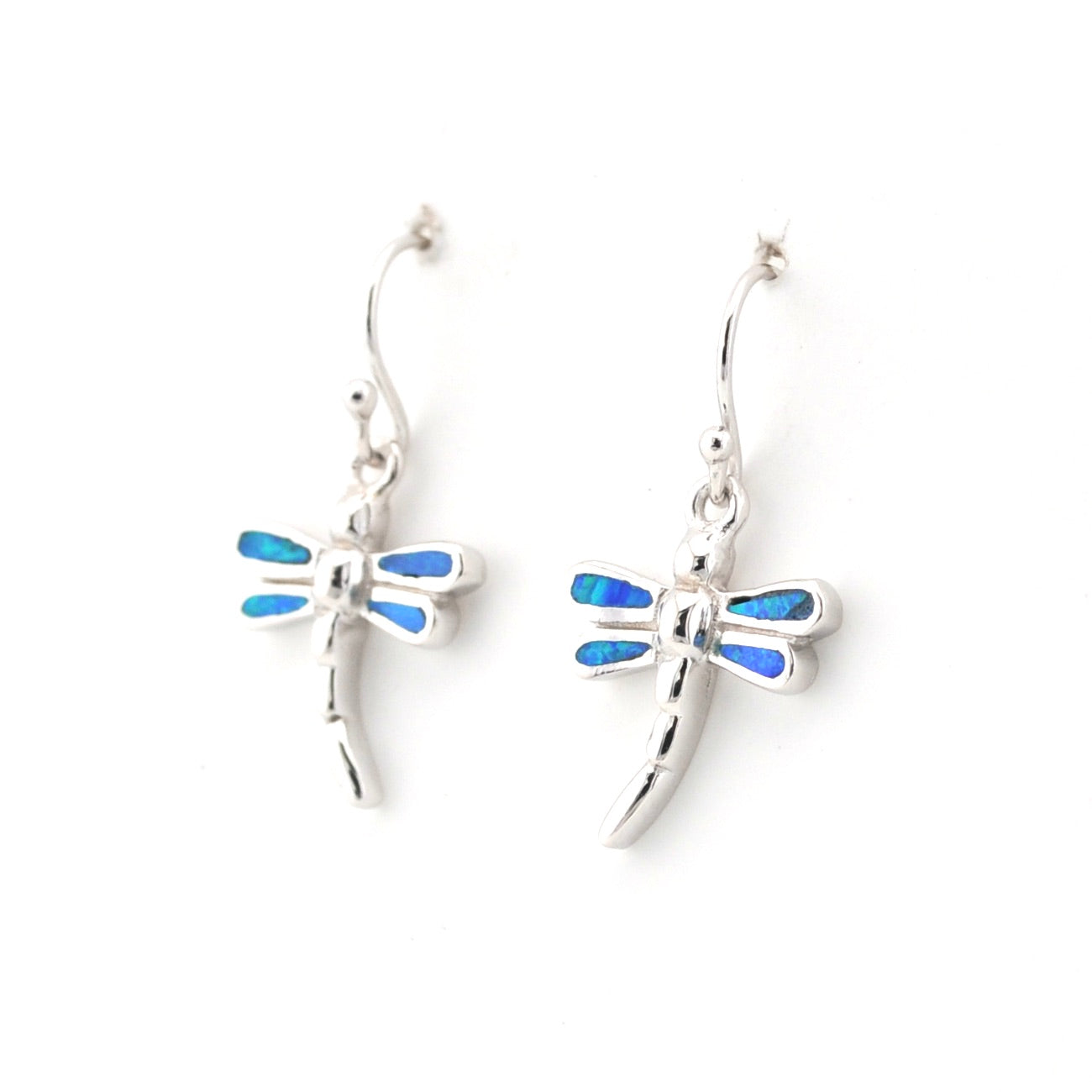 Silver dragonfly earrings with blue accents on a white background