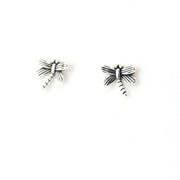 Pair of silver dragonfly-shaped earrings on a white background