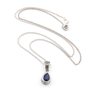 Silver necklace with a blue kyanite teardrop pendant on a white background