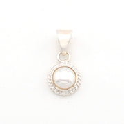 Pearl pendant with silver setting on a white background