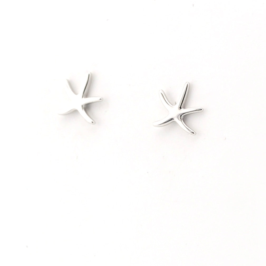 Pair of star-shaped earrings on a white background