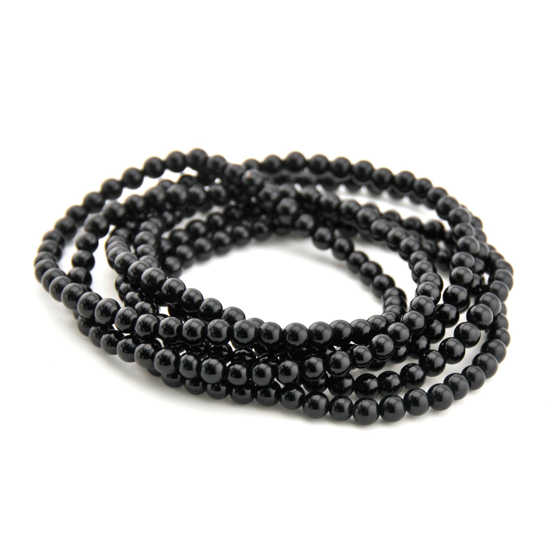 Black beaded necklace on a white background