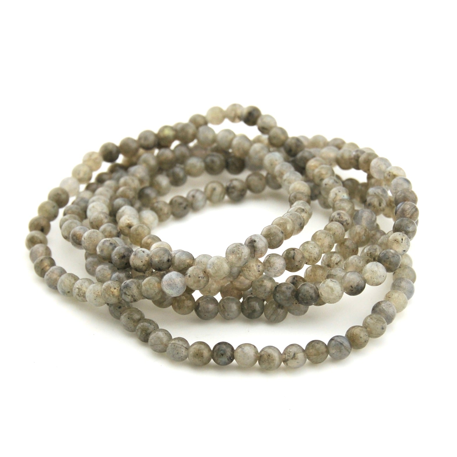 Beaded necklace with gray and white stones on a white background