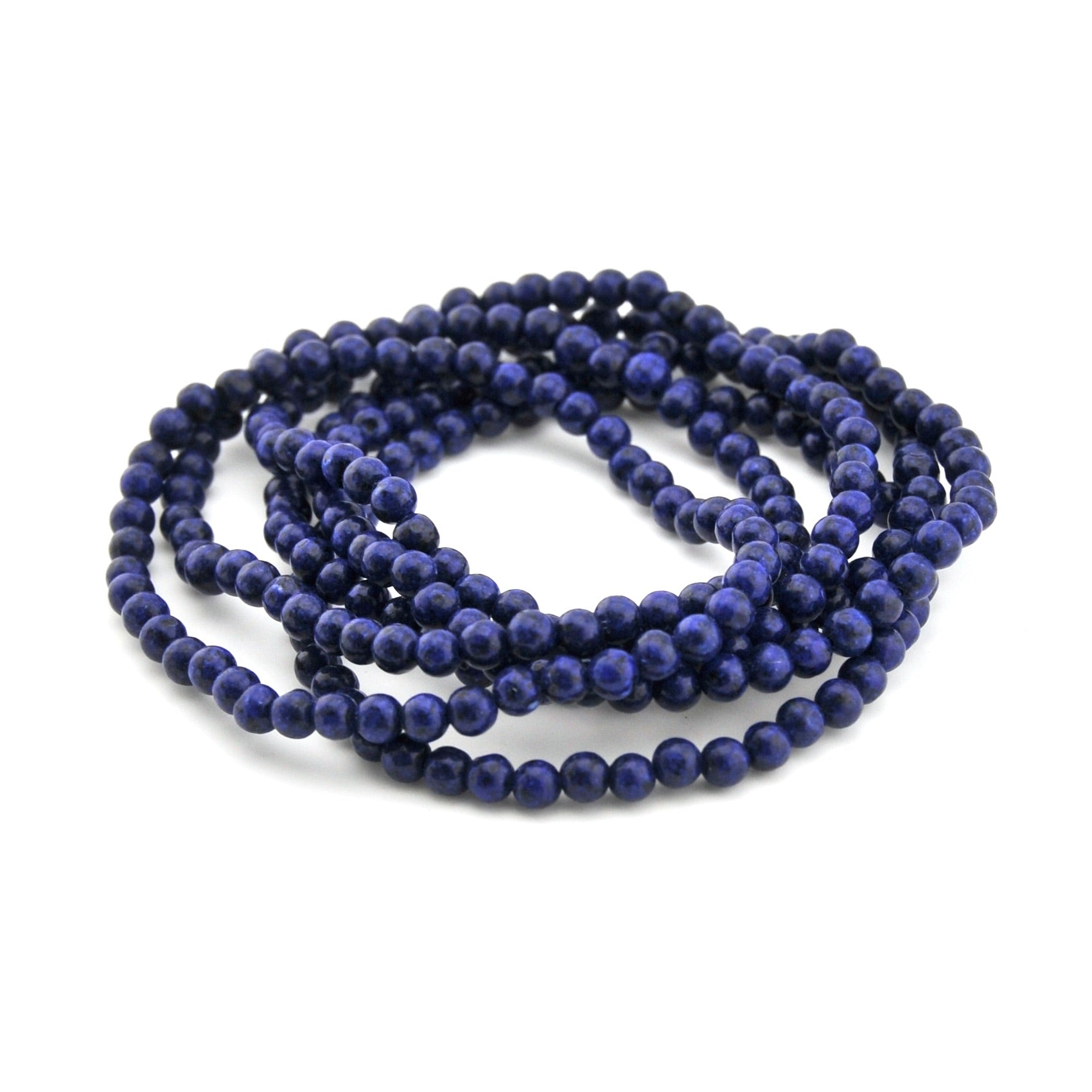 String of blue beads on a white background