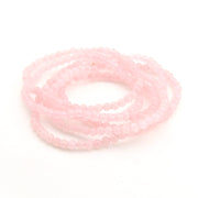 String of pink beads on a white background