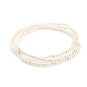 Set of three pearl bracelets on a white background