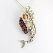 Side View Fossilized Ivory with Sterling Silver Water Spirit Mermaid Pendant