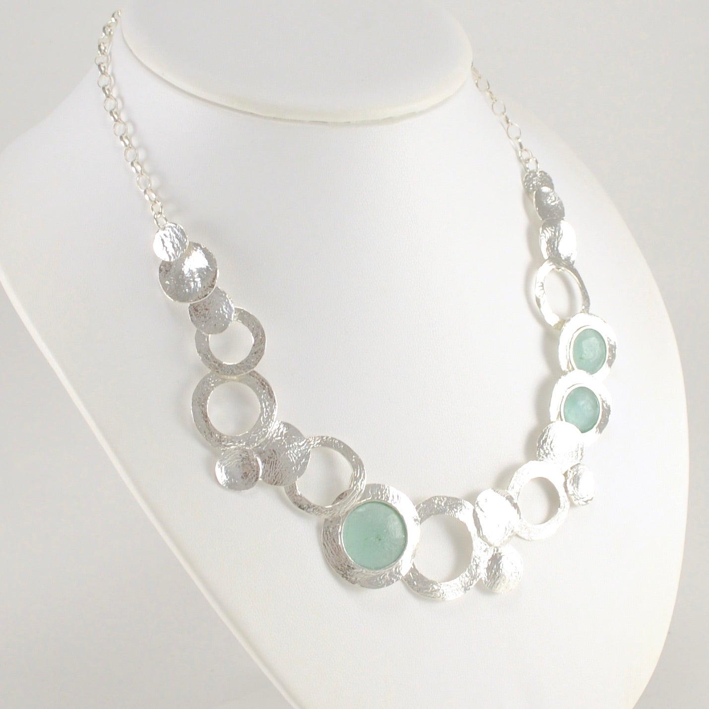 Side View Textured Sterling Silver Roman Glass Circle Necklace