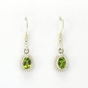 Alt View Sterling Silver Peridot 5x7mm Oval Dangle Earrings