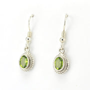 Side View Sterling Silver Peridot 5x7mm Oval Dangle Earrings