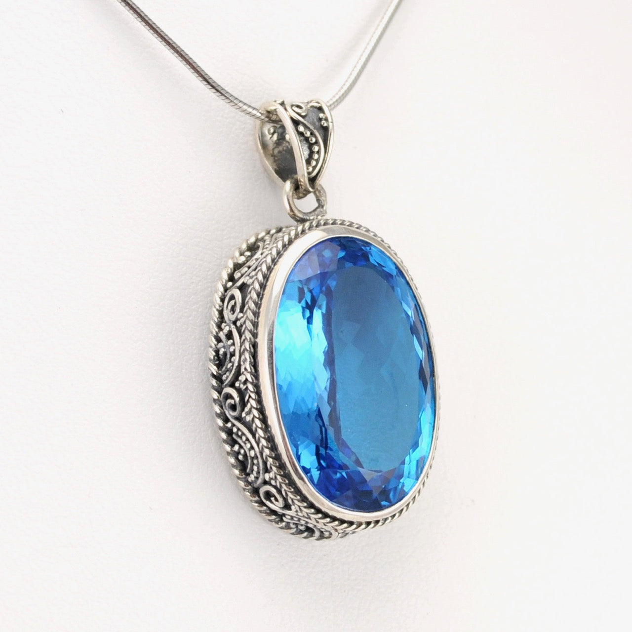 Side View Silver Blue Topaz 14x22mm Oval Bali Pendant