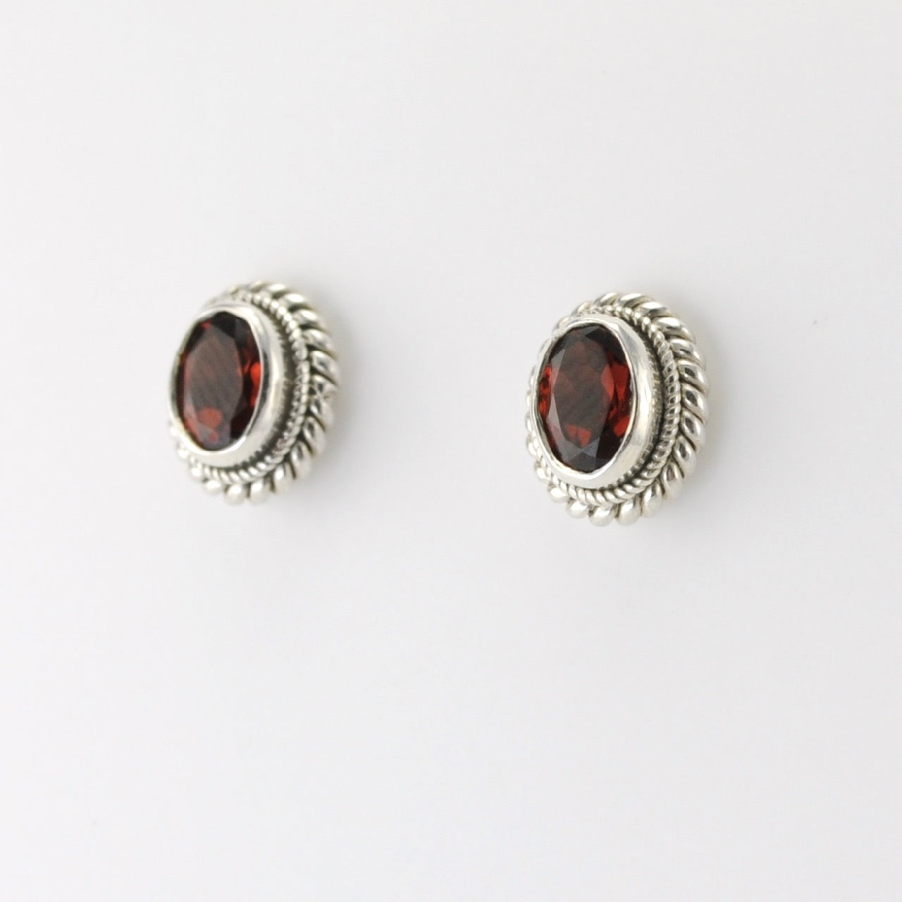 Side View Silver Garnet 5x7mm Oval Post Earrings