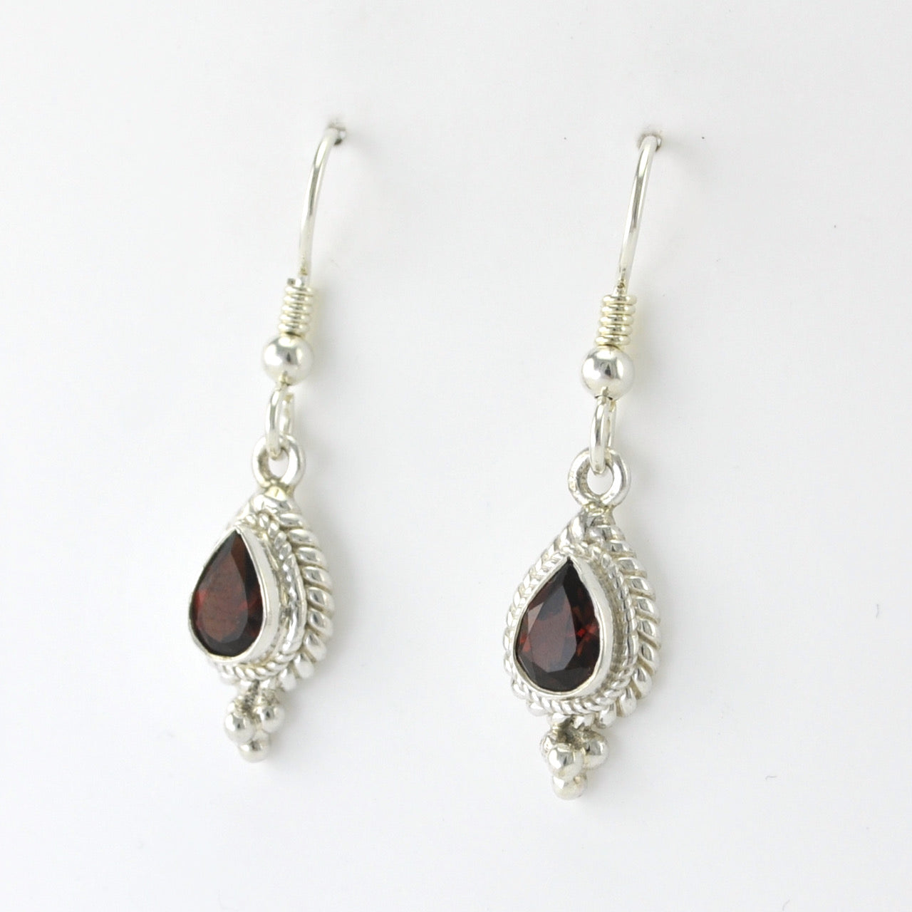 Side View Silver Garnet 5x7mm Tear Dangle Earrings