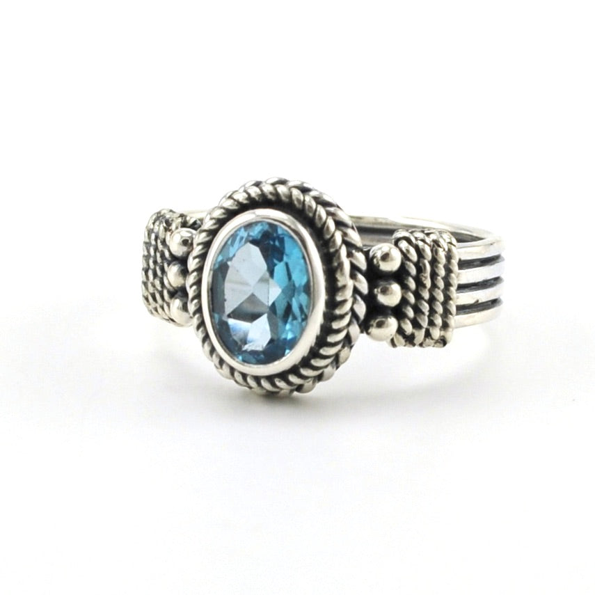 Sterling Silver Blue Topaz 6x8mm Oval 4 Band Ring