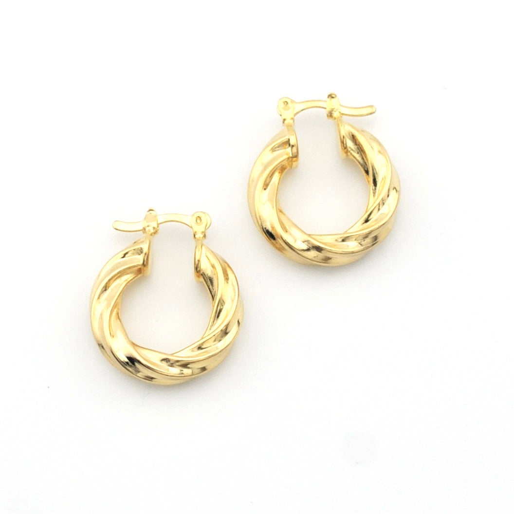 Pair of gold hoop earrings on a white background