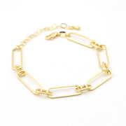 Gold chain bracelet on a white background