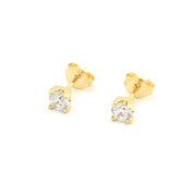 Gold stud earrings with clear gemstones on a white background