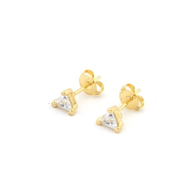 Gold triangle-shaped stud earrings on a white background