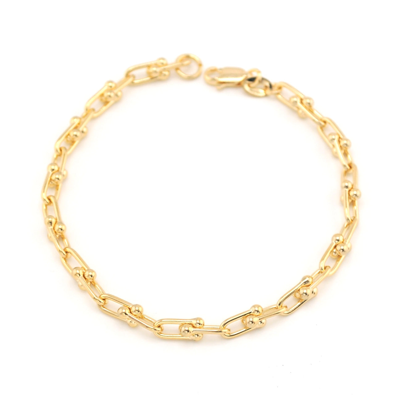 Gold chain bracelet on a white background