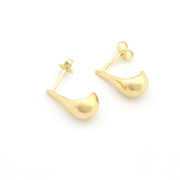 Gold hoop earrings on a white background