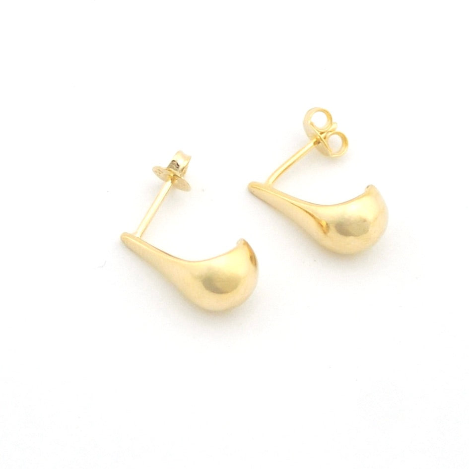 Gold hoop earrings on a white background