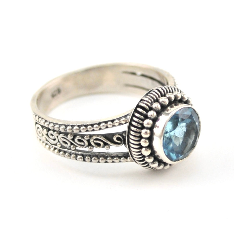 Side View Silver Blue Topaz 8mm Round 3 Band Scroll Ring