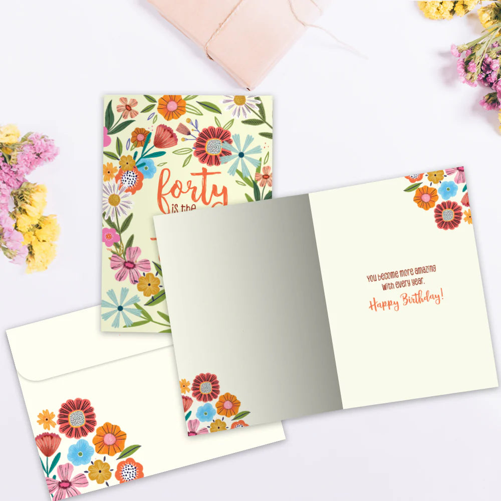 Floral birthday card with 'forty' text on a matching envelope, surrounded by flowers.
