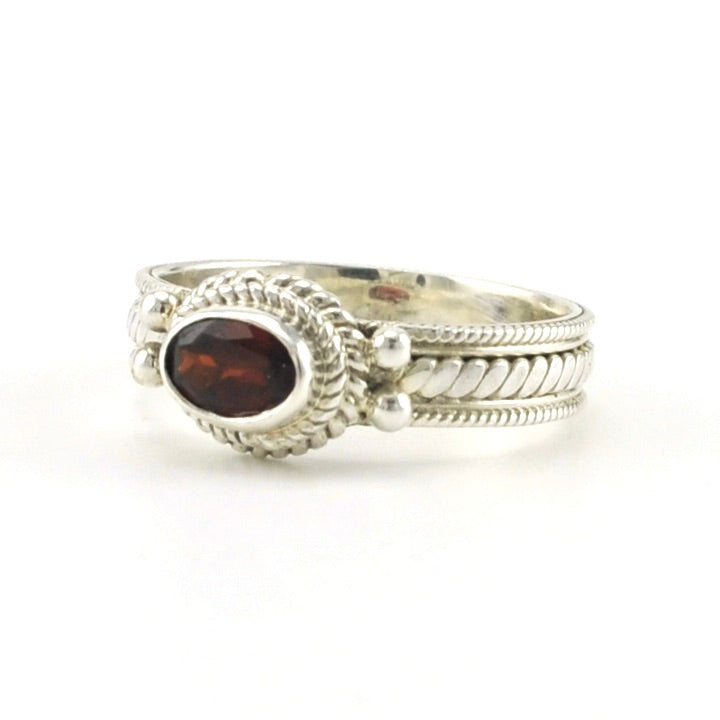 Side View Sterling Silver Garnet 4x6mm Oval Rope Band