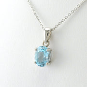 Side View Sterling Silver Blue Topaz Oval Drop Necklace