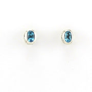 Alt View Sterling Silver Blue Topaz 4x6mm Oval Bali Post Earrings