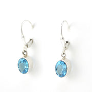 Side View Silver Blue Topaz 6x8mm Oval Dangle Earrings