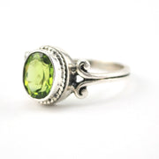 Side View Silver Peridot 7x9mm Oval Scroll Ring