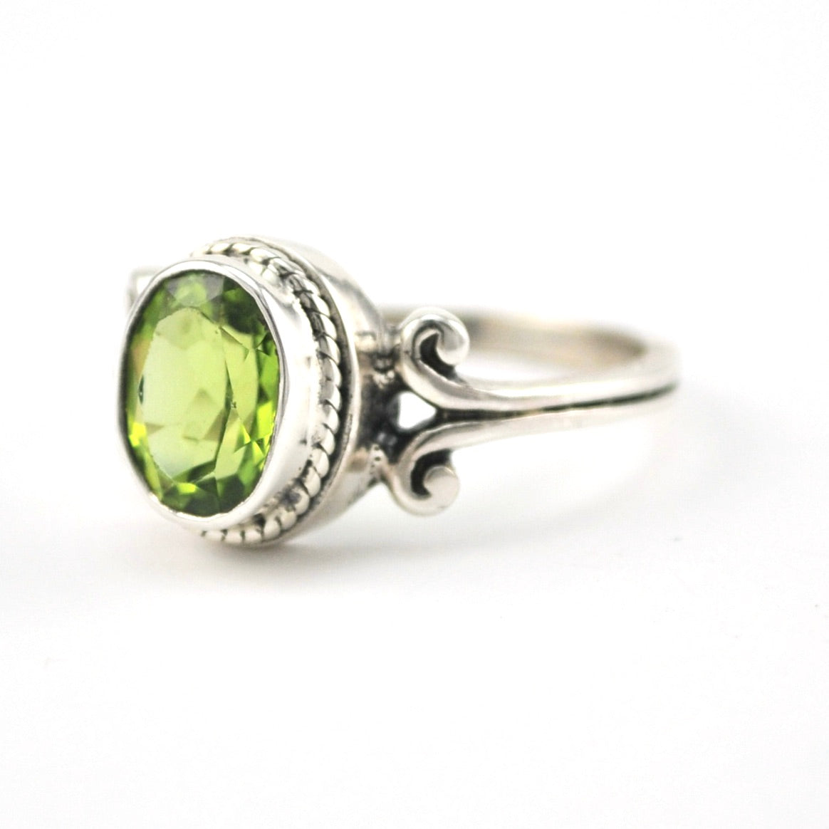 Side View Silver Peridot 7x9mm Oval Scroll Ring