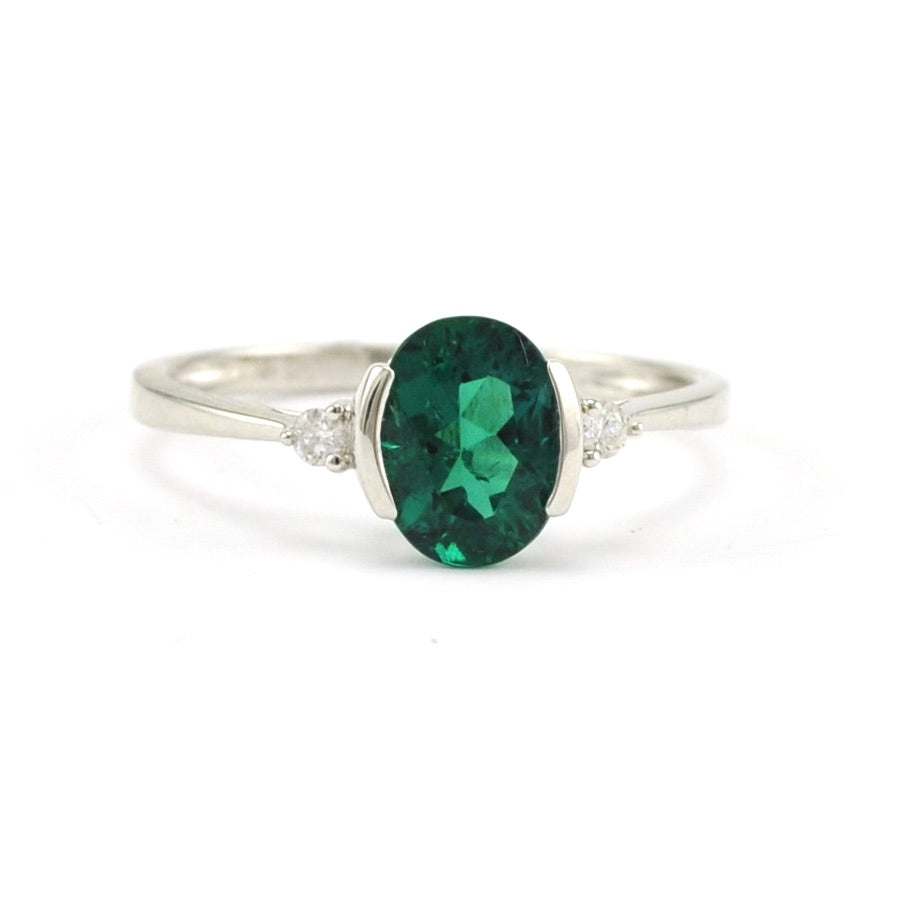 Sterling Silver Created Emerald 1.1ct Oval Diamond .06 Ring
