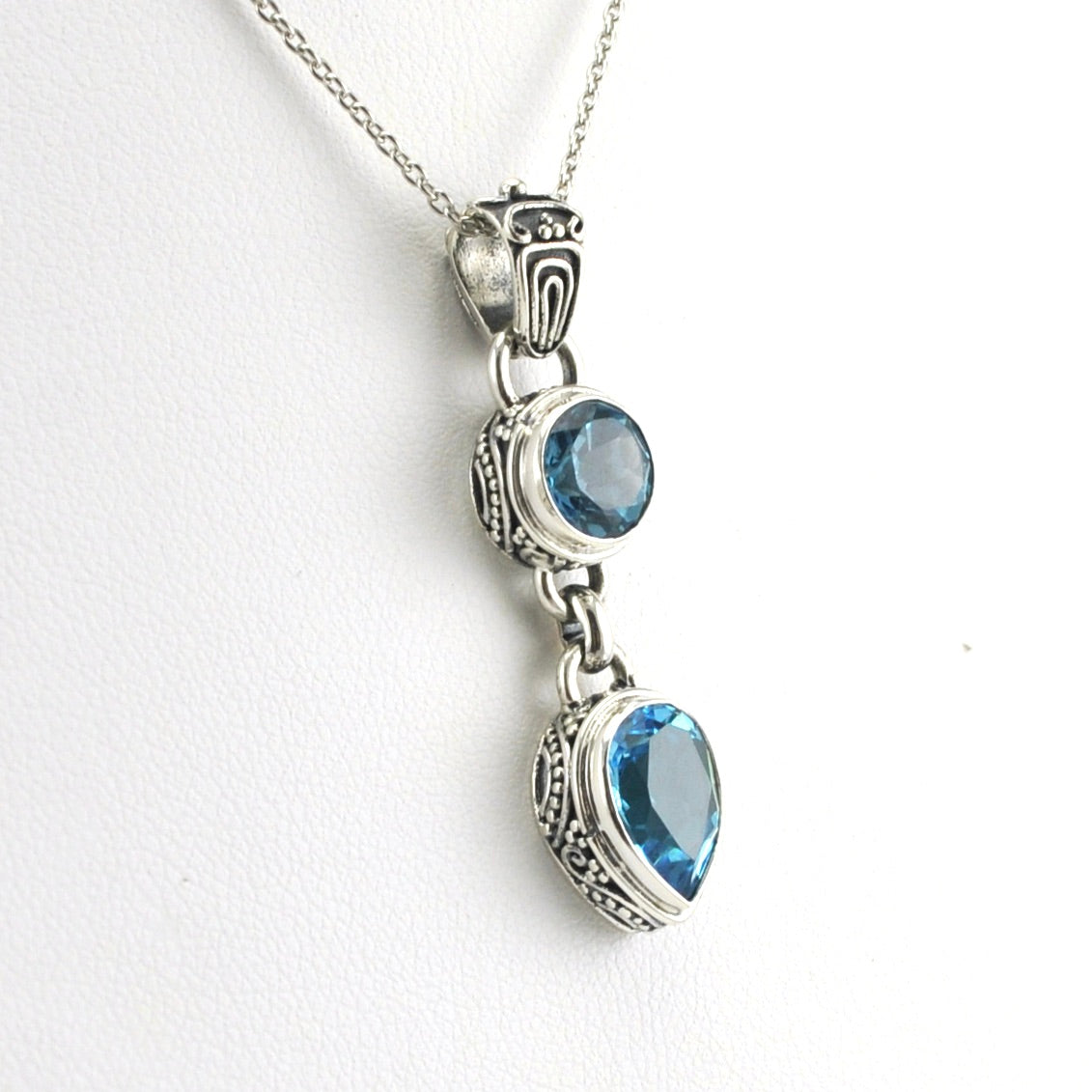Side View Sterling Silver Blue Topaz Round Pear Bali Necklace