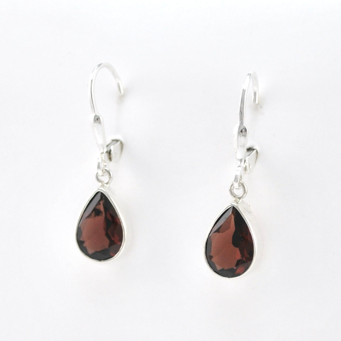 Side View Silver Garnet 7x10mm Teardrop Dangle Earrings