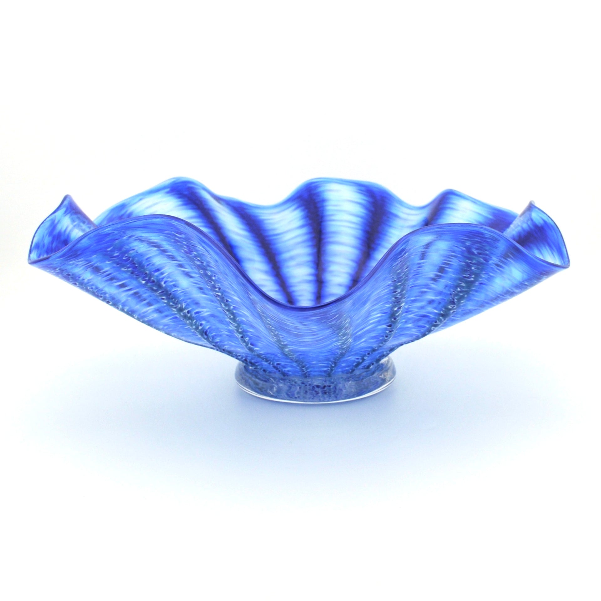 A cobalt blue textured glass bowl with a wavy, ruffled rim, displayed on a clean white background.