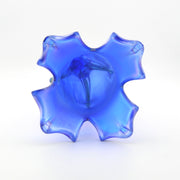 Blue glass vase with a unique design on a white background