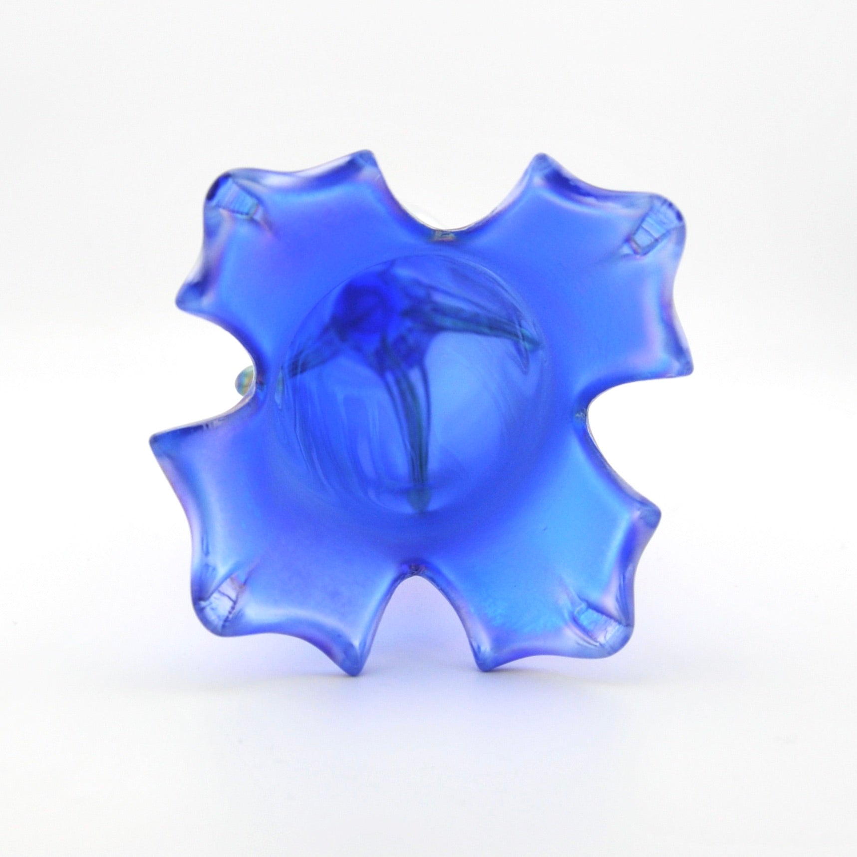 Blue glass vase with a unique design on a white background