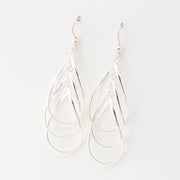 Silver teardrop earrings on a white background