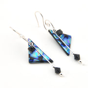 Pair of triangular earrings with black beads on a white background