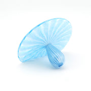 Blue glass sculpture on a white background