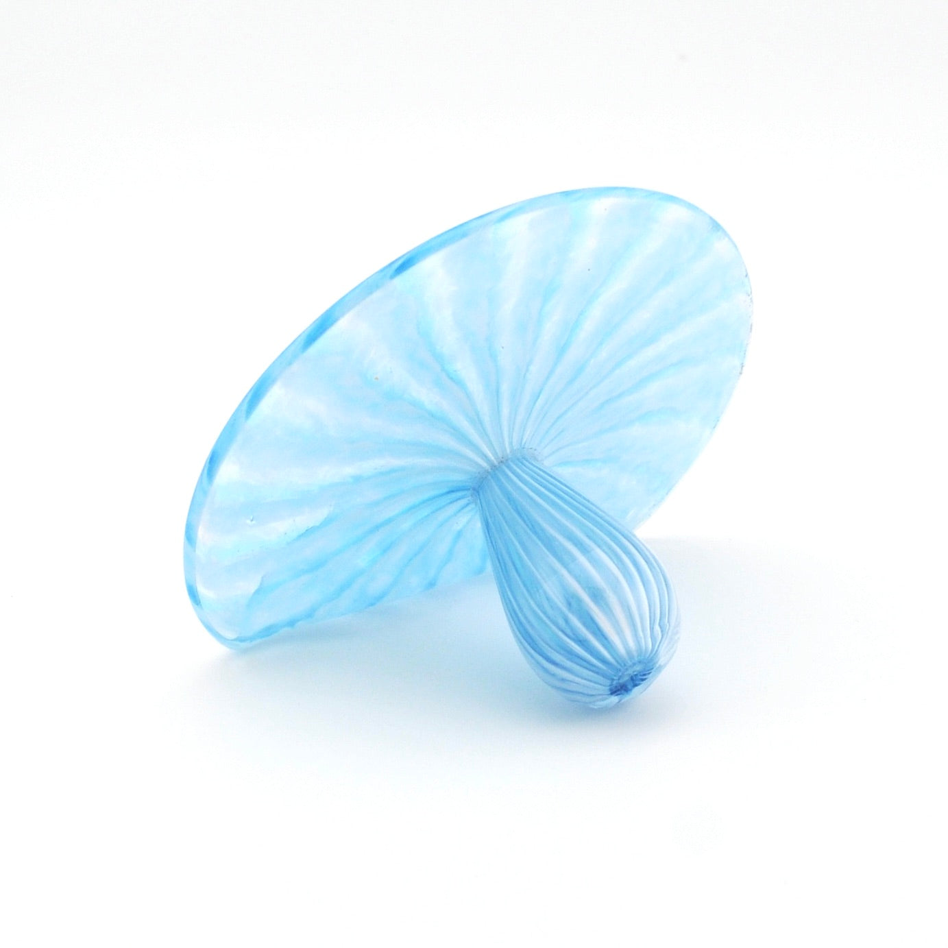 Blue glass sculpture on a white background