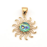 Gold sun-shaped pendant with a colorful center on a white background