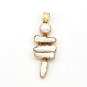 Gold pendant with pearls on a white background