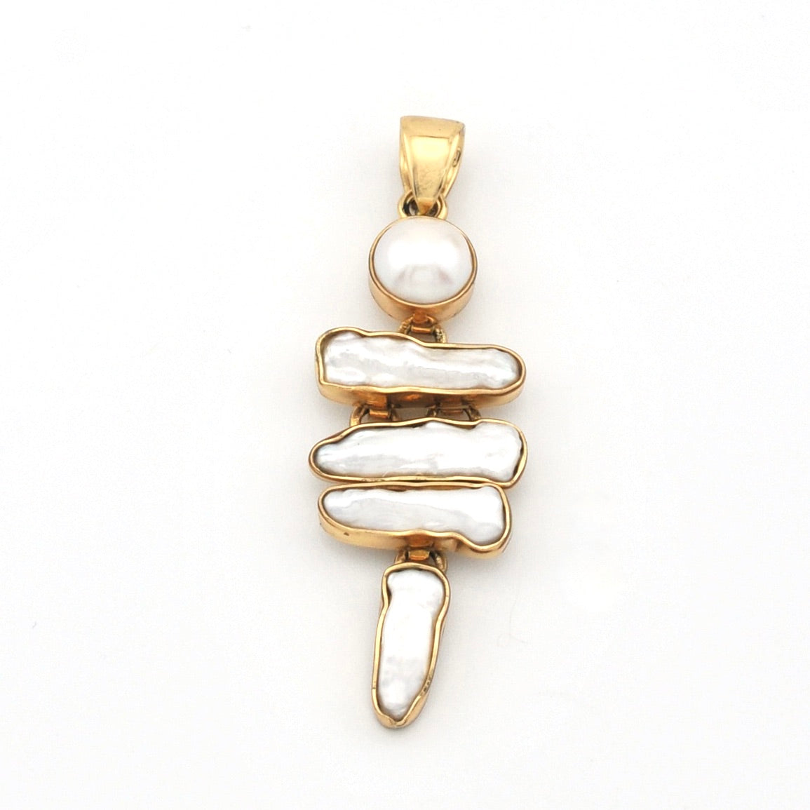 Gold pendant with pearls on a white background